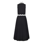 Ghost image, back view of black fit and flare polka dot midi dress.  Collar and belt is white with black polka dots and main dress is all black with white buttons on centre front. 
